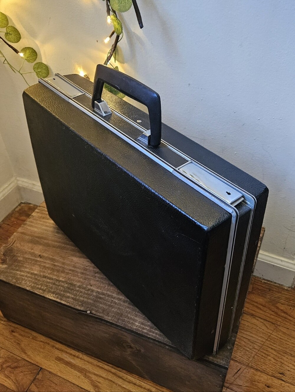 Vintage black hardshell attaché case or briefcase with a textured finish & silve